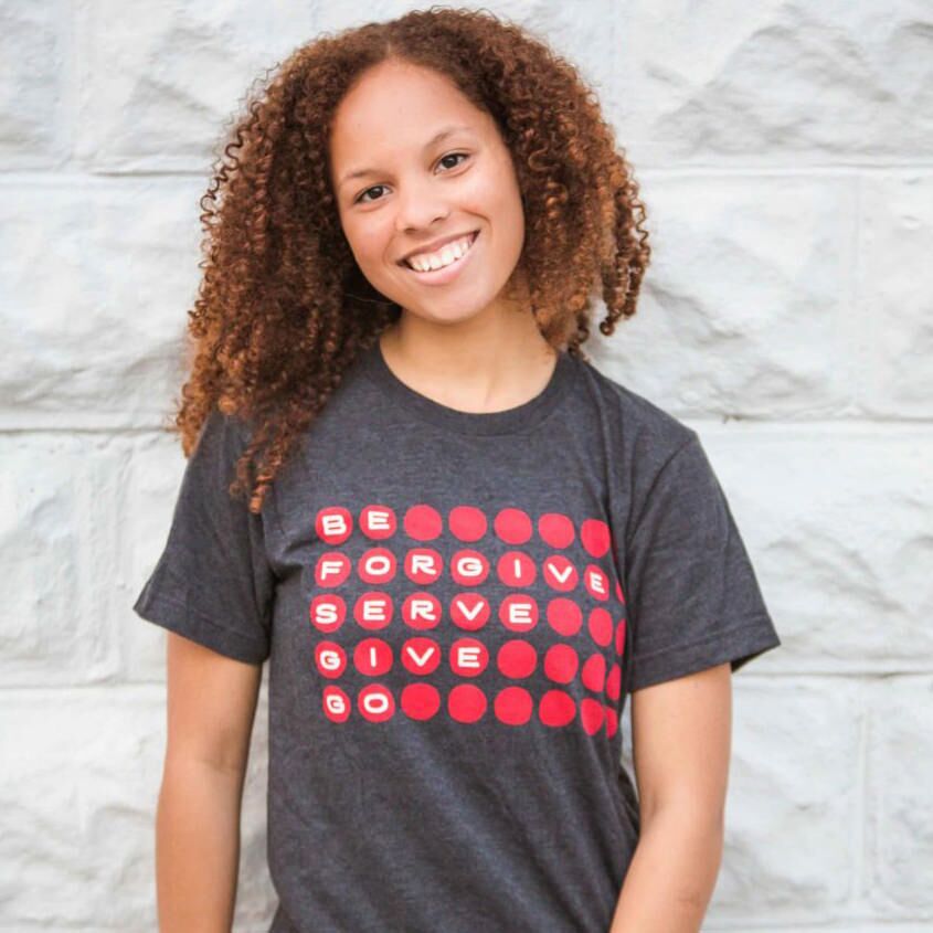 Wearing forgiveness shirt.
